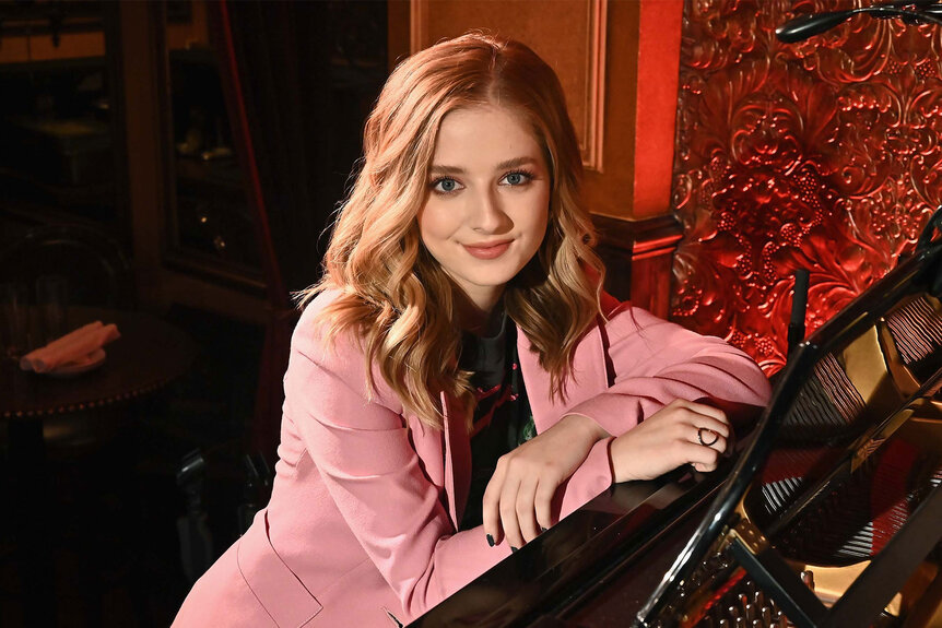 Jackie Evancho smiles while posing for photos