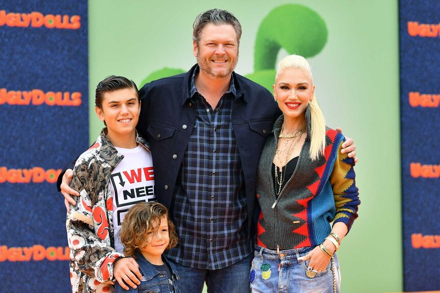 Kingston Rossdale, Apollo Bowie Flynn Rossdale, Blake Shelton, and Gwen Stefani appear at an event.