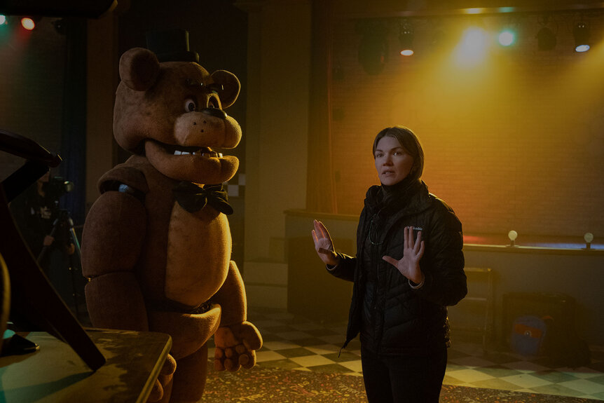Emma Tammi directing a scene in Five Nights At Freddy's