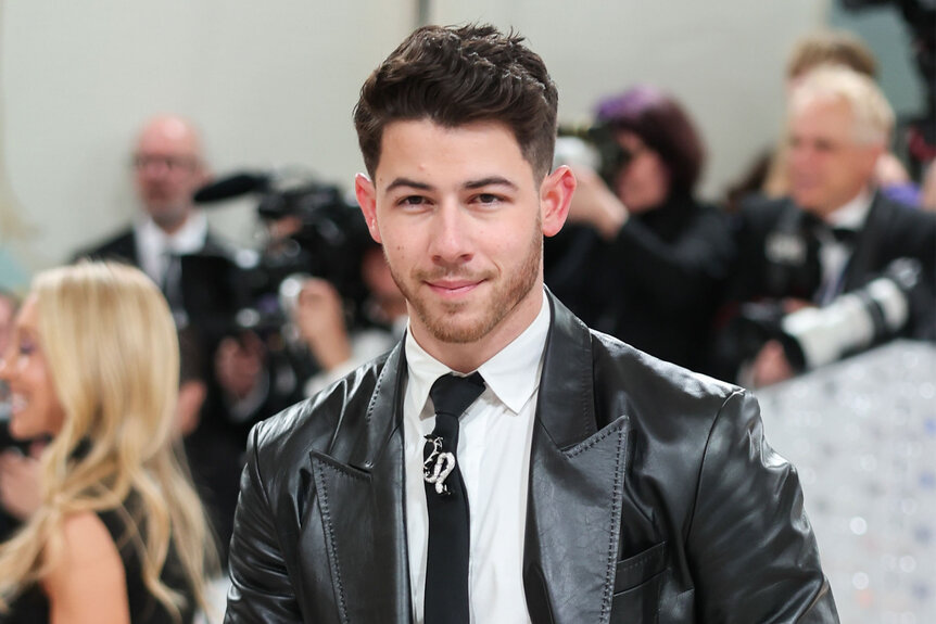 Nick Jonas smiles on the red carpet of the Met Gala