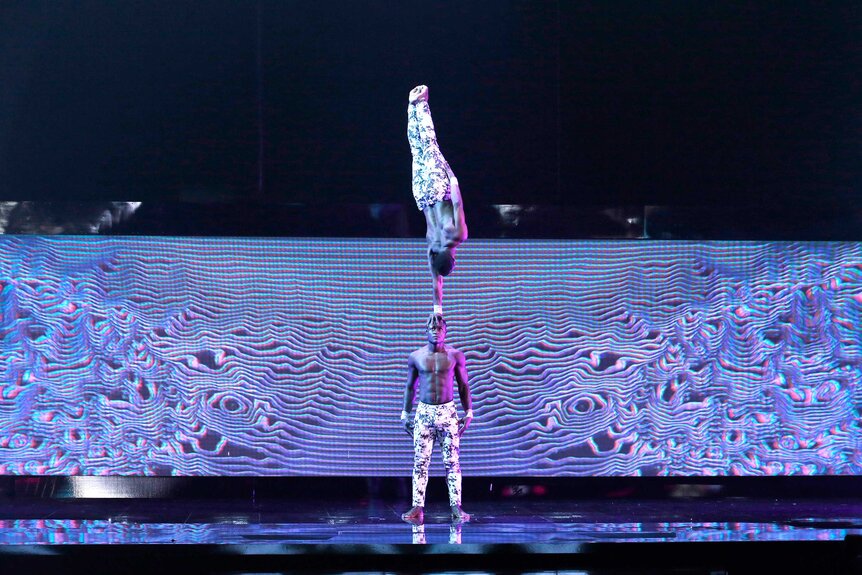 Ramadhani Brothers balancing one another during their performance on America's Got Talent.