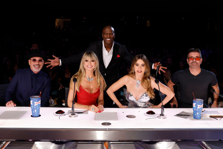 Howie Mandel, Hedi Klum, Terry Crews, Sofia Vergara, and Simon Cowell smile behind the judges's table during the America's Got Talent Season 18 finale