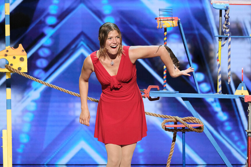 Melissa Arleth has her rat Hanta climb on her arm on stage during America's Got Talent.