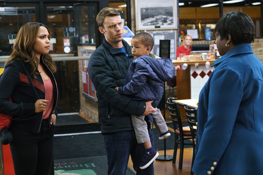 Gabriela Dawson, Matthew Casey, and Louie appear in a scene from Chicago Fire.