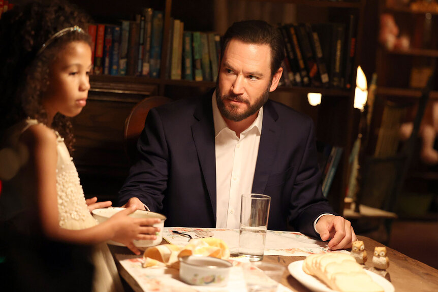 Sir (Mark-Paul Gosselaar) speaks to Bella (Jasmine Washington) during dinner