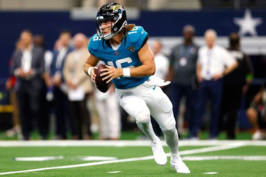 Jacksonville Jaguars Trevor Lawrence looks to pass during a game.