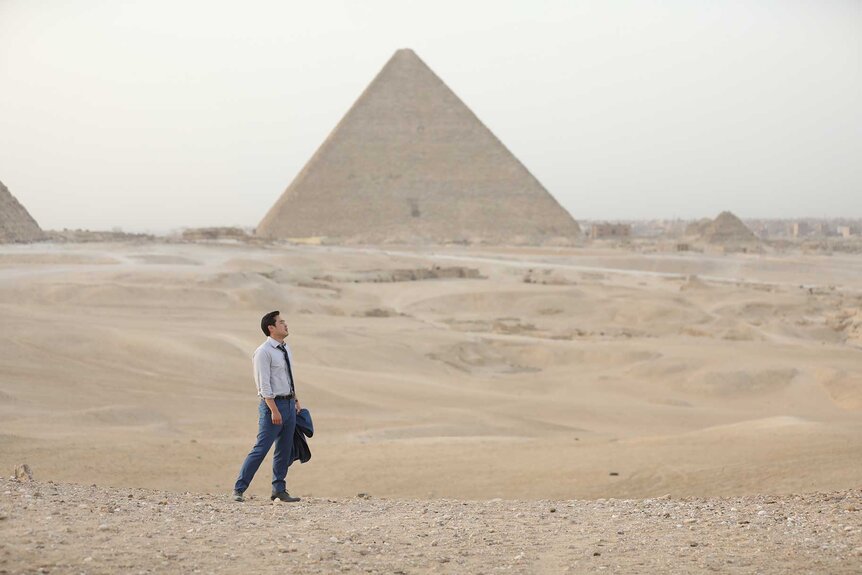 Dr. Ben Song appears in front of pyramids in a scene from Quantum Leap.