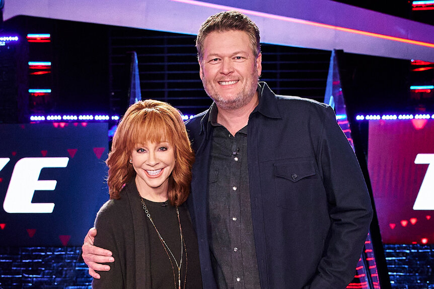 (l-r) Reba Mcentire is embraced by Blake Shelton on The Voice