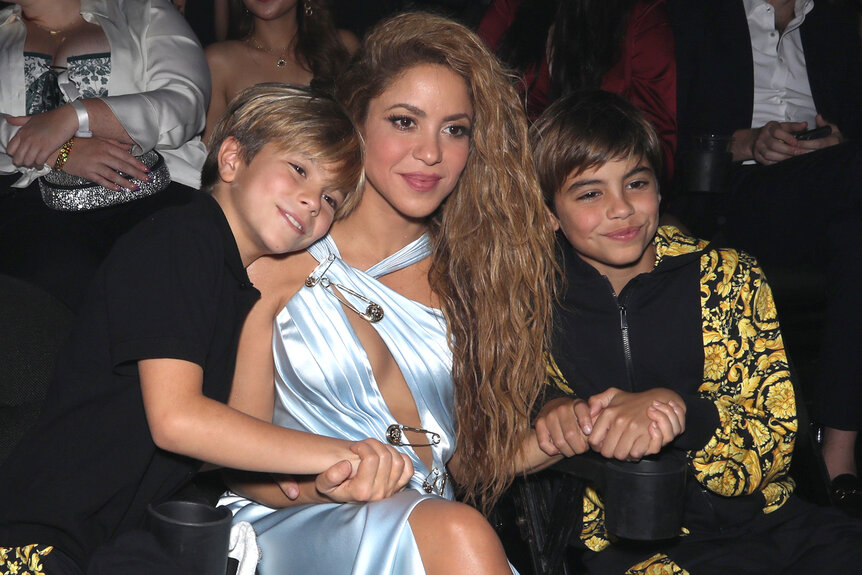 Sasha Piqué, Shakira, and Milan Piqué sit in the audience of the MTV Video Music Awards