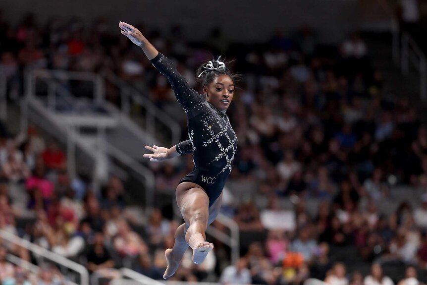 Simone Biles competing in the floor exercise during the 2023 U.S. Gymnastics Championships.