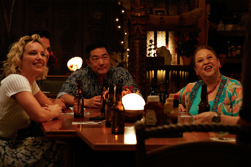 Juliet Higgins (Perdita Weeks), Detective Gordon Katsumoto (Tim Kang), and Kumu (Amy Hill) sit at a table together