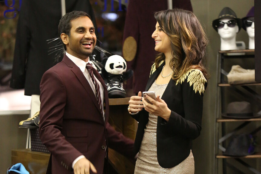 Aziz Ansari as Tom Haverford, and Jenny Slate as Mona-Lisa Saperstein laughing together