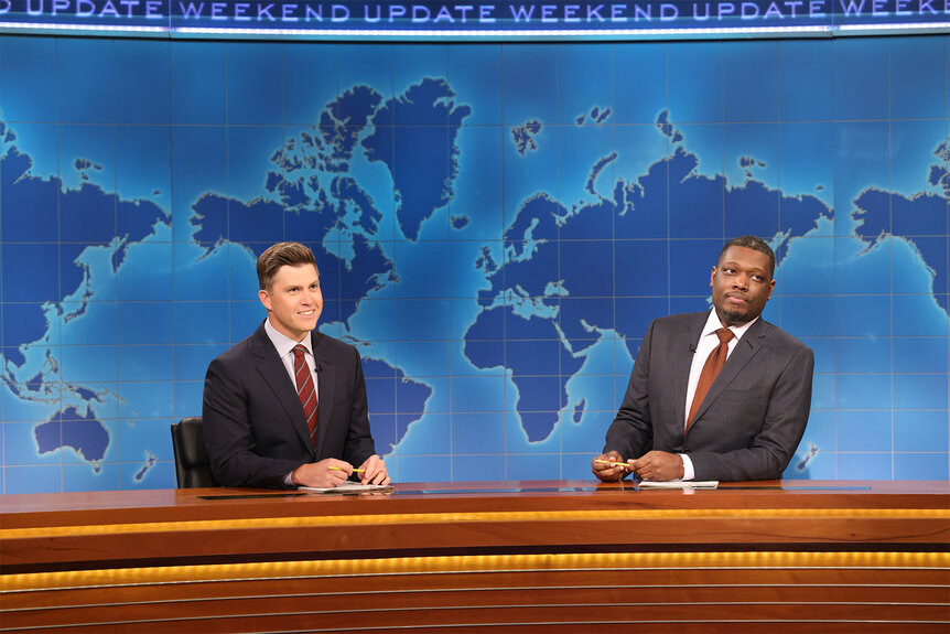 Colin Jost and Michael Che doing weekend update on Saturday Night Live