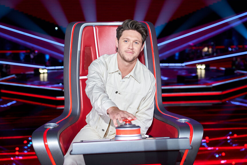 Niall Horan sits in his chair