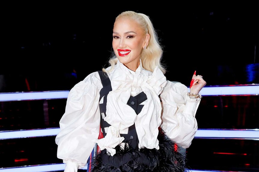 Gwen Stefani poses at her coaches chair on The Voice episode 2410