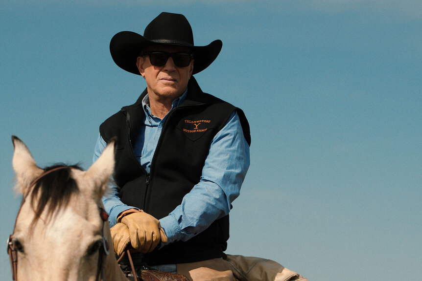 Kevin Costner rides a horse