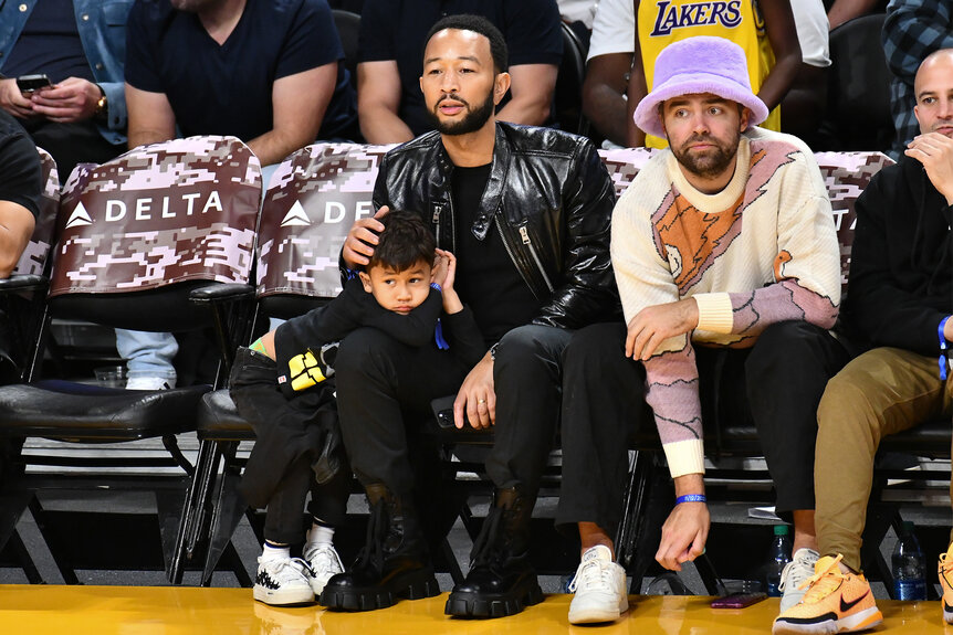 John Legend and his son Miles sit court side at the Lakers Game