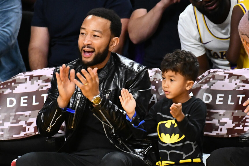 John Legend and his son Miles sit court side at the Lakers Game