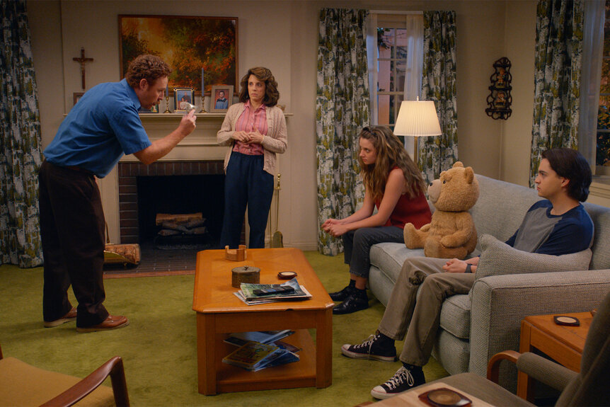 Matty, Susan, Blaire, Ted and John sit in the living room on Season 1 Episode 1 of Ted.