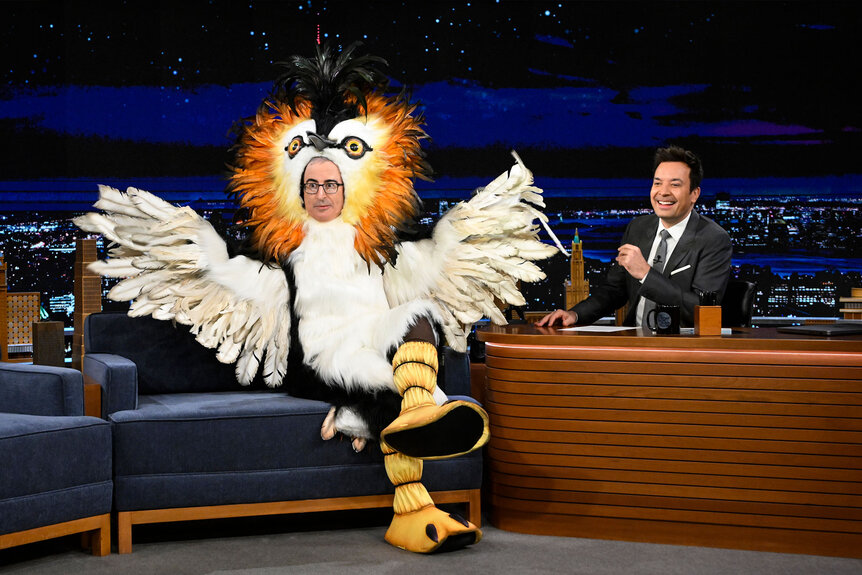 The Tonight Show John John Oliver being interviewed by Jimmy Fallon on the Tonight Show