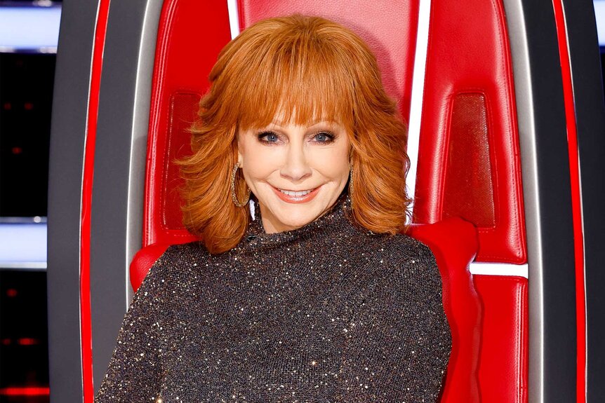 Reba McEntire sits in his coaches chair on the voice episode 2415
