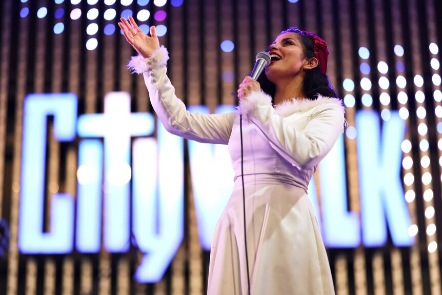 A performer singing on stage at Universal CityWalk Hollywood.
