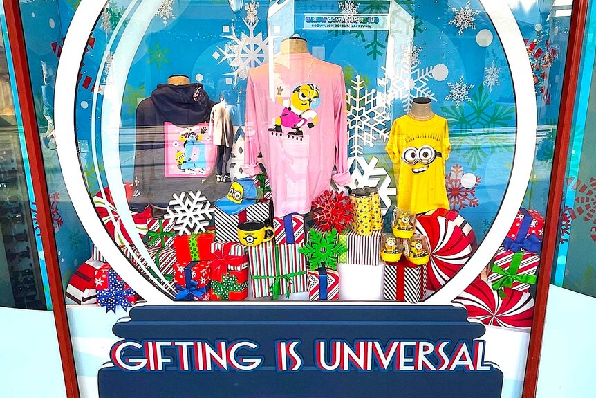 A window display of Minion merchandise decorated for Christmas.