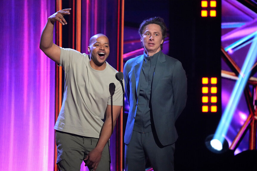 Donald Faison and Zach Braff speak onstage during the 2023 iHeartRadio Music Awards at Dolby Theatre in Los Angeles, California on March 27, 2023.