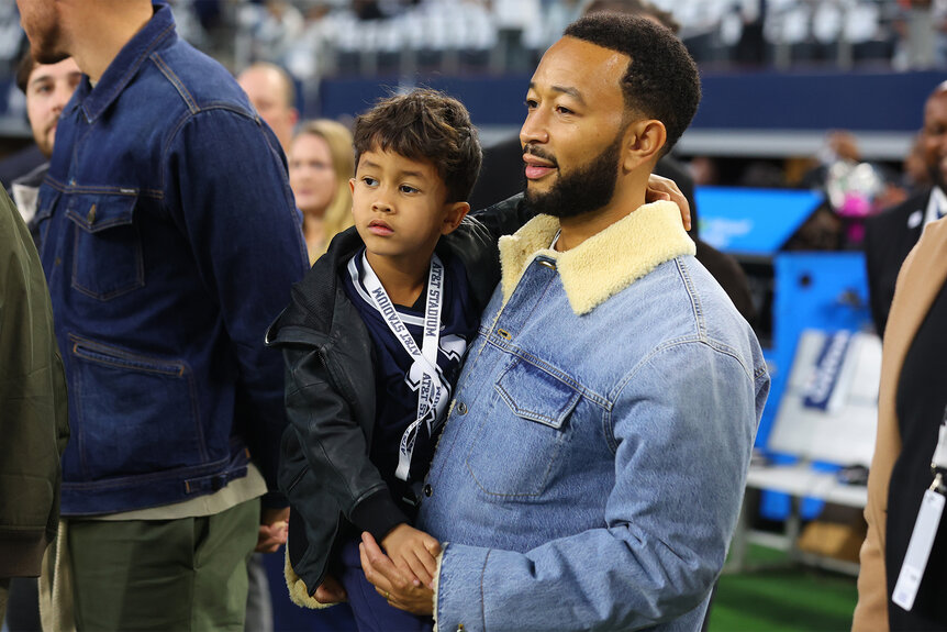 John Legend and his son Miles Stephenson watch the Dallas Cowboys Game