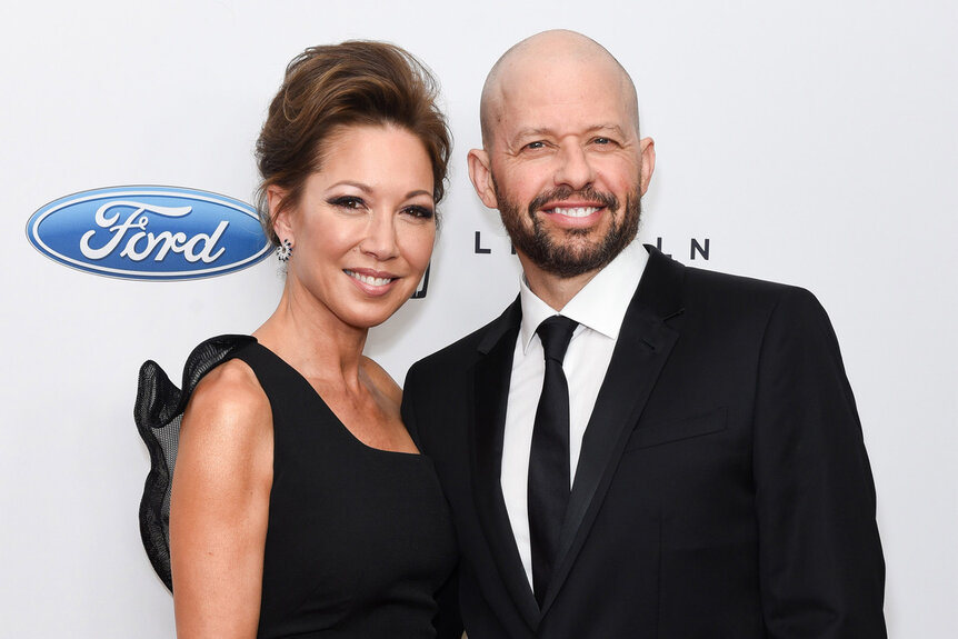 Lisa Joyner and Jon Cryer smile together as they attend a red carpet