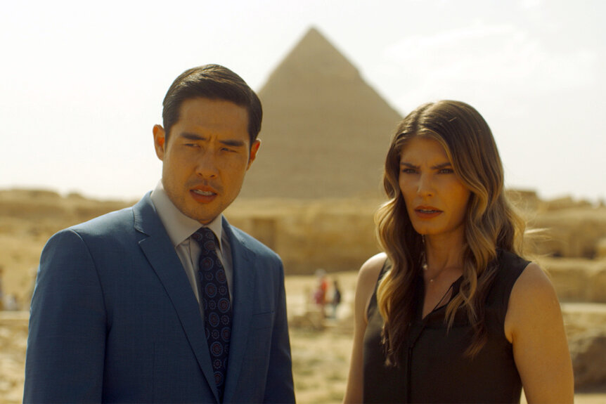 Dr Ben Song and Addison stand in front of a pyramid on Quantum Leap episode 208