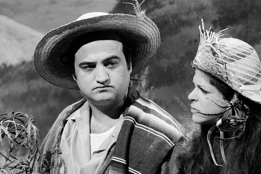 John Belushi appears in a Season 1 episode of Saturday Night Live