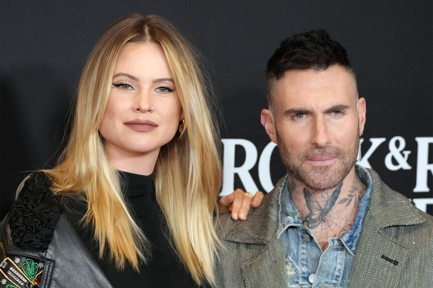 Behati Prinsloo and Adam Levine pose for a photo together