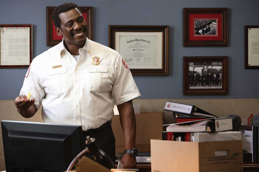 Chief Wallace Boden smiles in his office on Chicago Fire Episode 1001