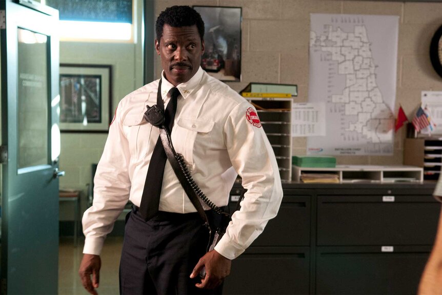 Chief Wallace Boden stands in an office on Chicago Fire Episode 101