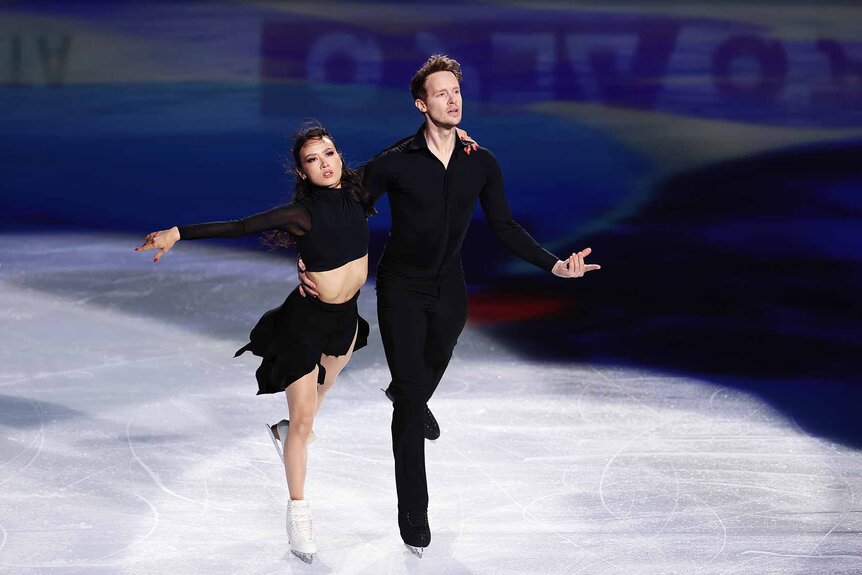 Madison Chock and Evan Bates figure skate in all black.