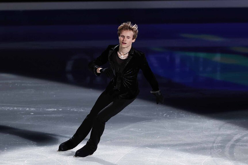 Ilia Malinin figure skates in all black.