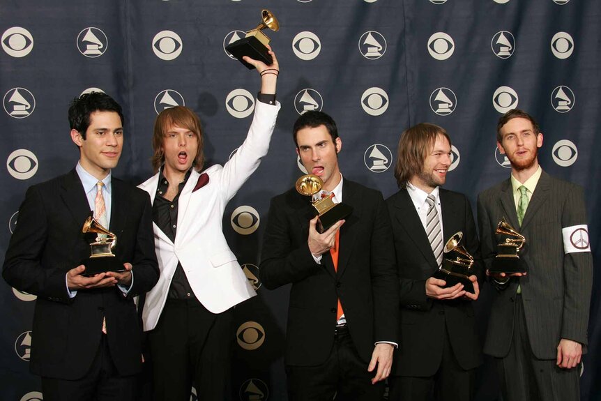 Maroon 5 poses with their Grammys at the 47th Annual Grammy Awards.