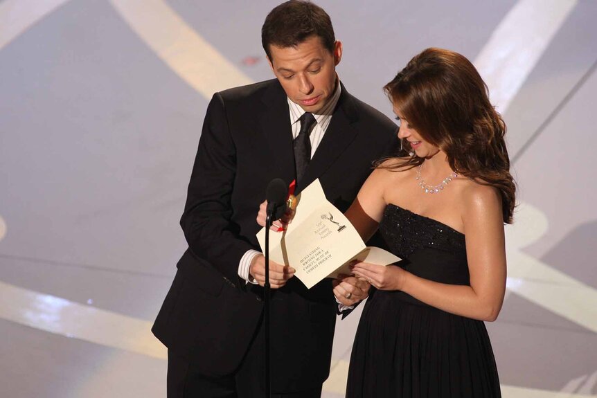 Jon Cryer and Jennifer Love Hewitt present an award onstage at the 59th Annual Primetime Emmy Awards