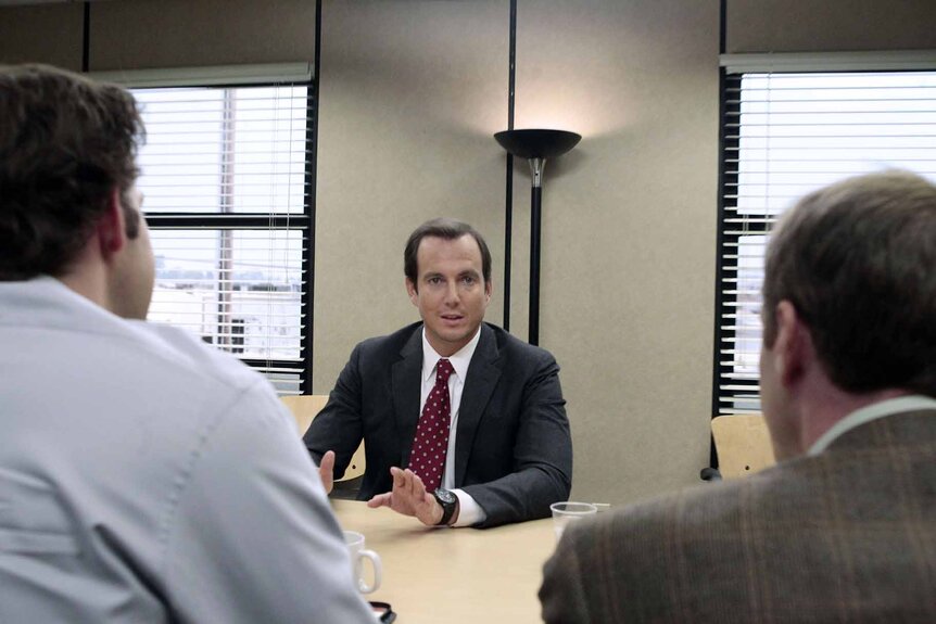 Fred Henry (Will Arnett) sits at a desk across from Jim and Michael in The Office Episode 725/726.