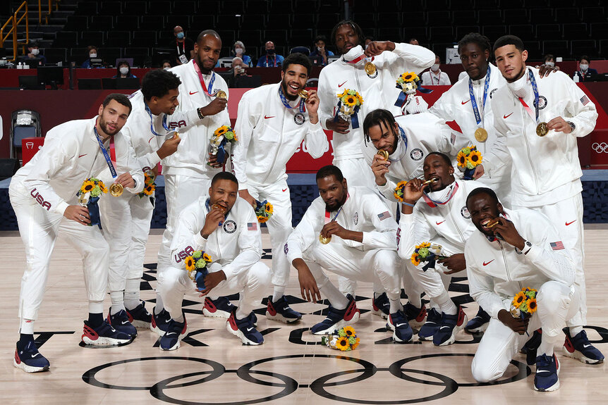 Team United States pose for photographs with their gold medals during the Men's Basketball medal ceremony