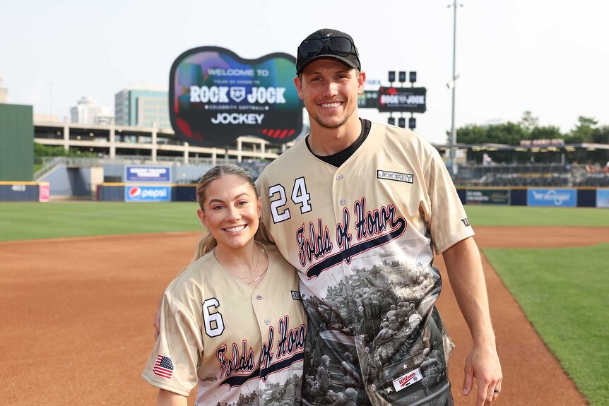 Shawn Johnson stands with her husband Andrew East at the Rock N' Jock Celebrity Softball Game