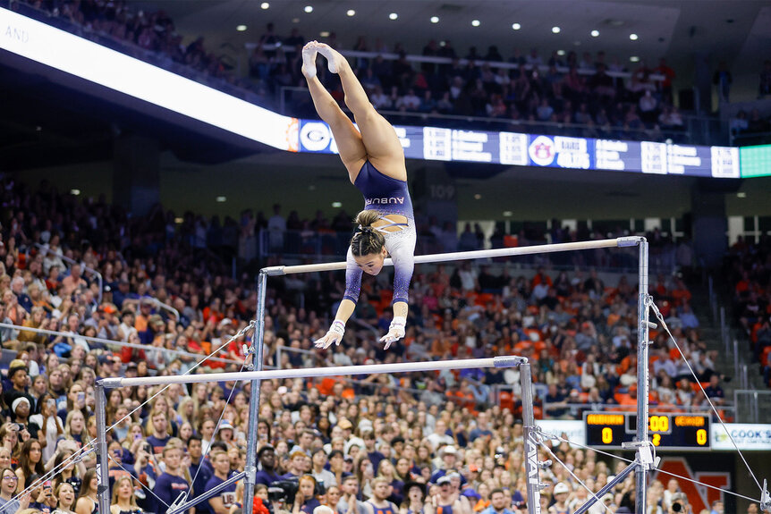 Suni Lee on the uneven bars during a gymnastics meet