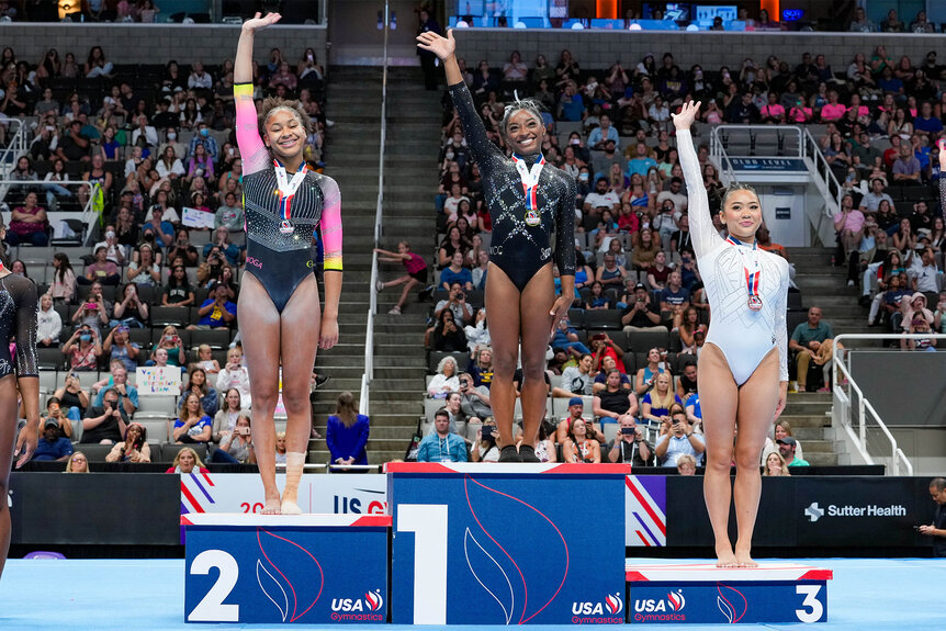 Suni Lee Skye Blakely and Simone Biles celebrate during 2023 Xfinity U.S. Gymnastics Championships
