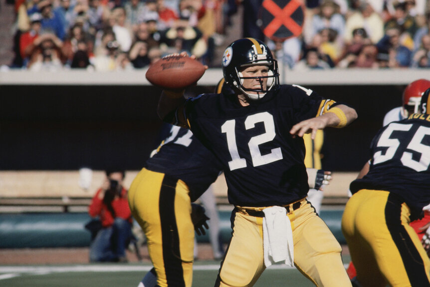 Pittsburgh Steelers' quarterback Terry Bradshaw prepares to throw a pass to one of his fellow teammates