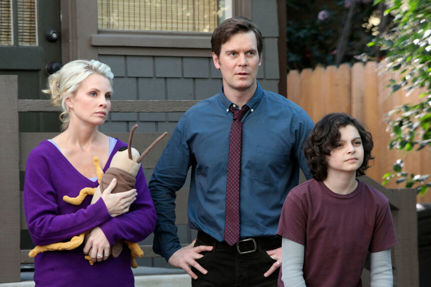Kristina Braverman (Monica Potter), Adam Braverman (Peter Krause), and Max Braverman (Max Burkholder) appear in a scene from Parenthood