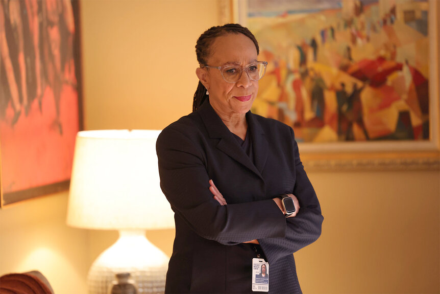 Sharon Goodwin stands with her arms crossed on Chicago Med Episode 905