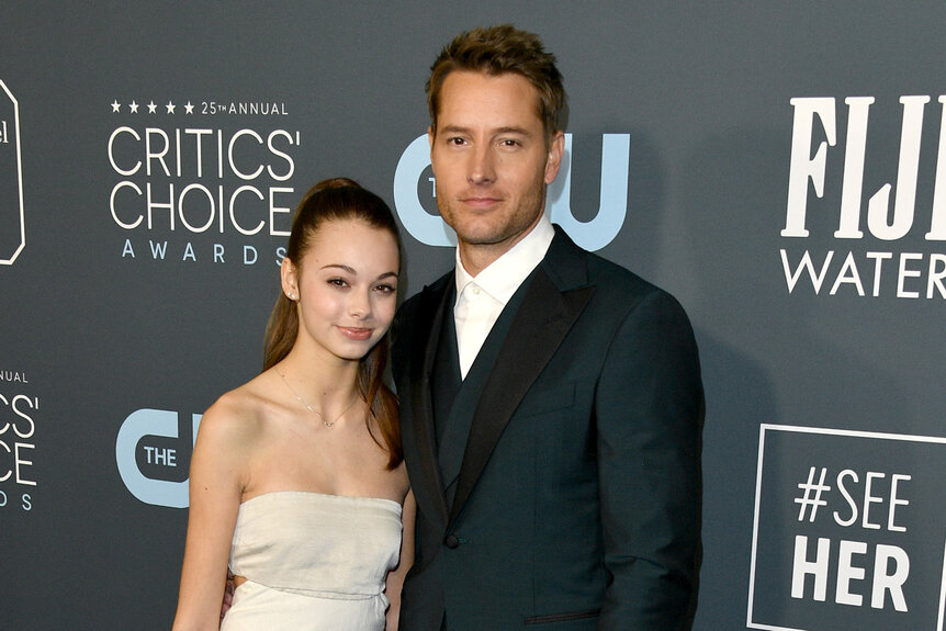 Justin Hartley and his daughter Isabella Justice Hartley pose together on the red carpet of the critics choice awards