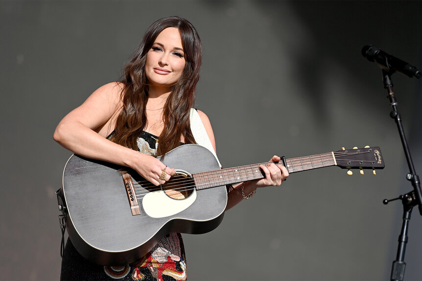 Kacey Musgraves plays the guitar on stage during the Glastonbury Festival