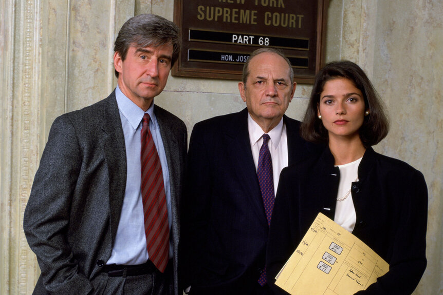 Sam Waterston as Executive A.D.A. Jack McCoy, Steven Hill as D.A. Adam Schiff, and Jill Hennessy as A.D.A. Claire Kincaid in promotional images for Season 5 of Law & Order
